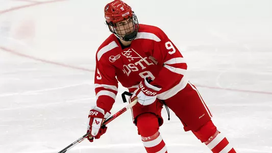 Ryan Greene passing the puck