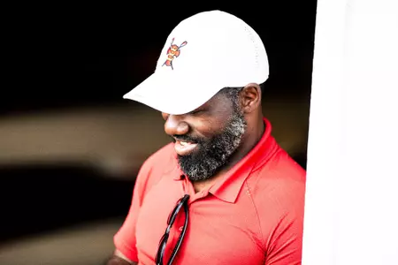 Photo of BU Director of Women's Rowing Malcolm Doldron at the DeWolfe Boathouse.