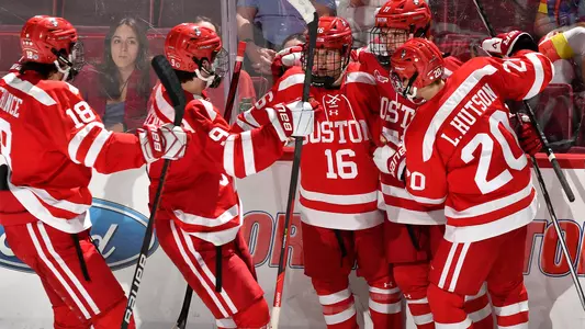 The men's ice hockey team celebrates a goal at UMass