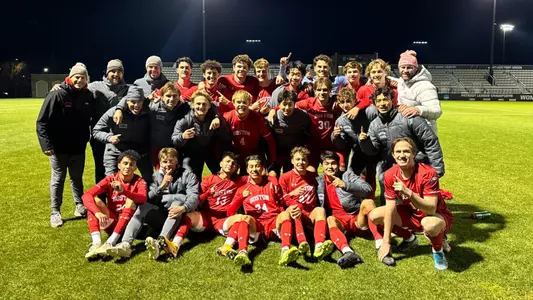 BU men's soccer team poses for a group photo at Army after winning the 2023 Patriot League regular season title