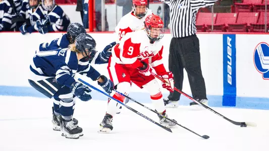 Alex Law skates with the puck against UNH
