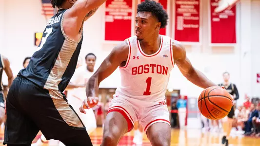 Ethan Okwuosa handles the ball vs. Bryant in the 2023-24 home opener