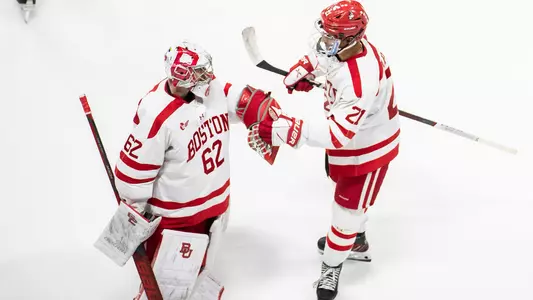 Devin Kaplan high-fives Mathieu Caron after a BU goal