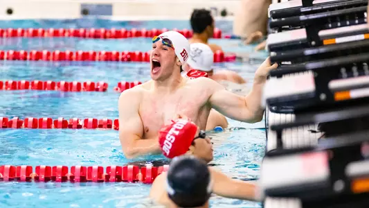 Kyle Falkstrom celebrates his pool and school record in the 200 breaststroke