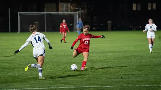Photo of women's soccer junior Morgan Fagan attempting a shot against Bucknell in the PL Semifinal.