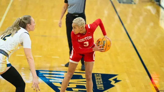 Photo of women's basketball senior Kelsi Mingo looking to pass the ball.