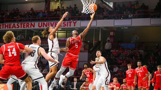 Kyrone Alexander goes for a layup attempt at Northeastern.