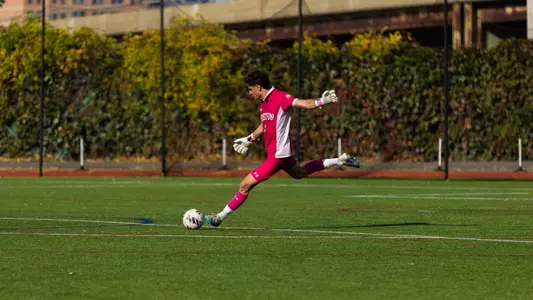 Francesco Montali is the middle of a kicking motion with the soccer ball.