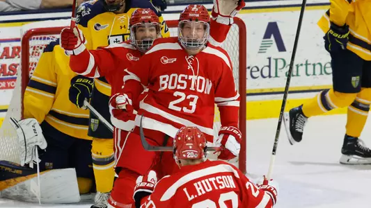 Doug Grimes and Sam Stevens are celebrating Grimes' goal at Merrimack
