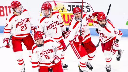 BU men's ice hockey players celebrating a goal