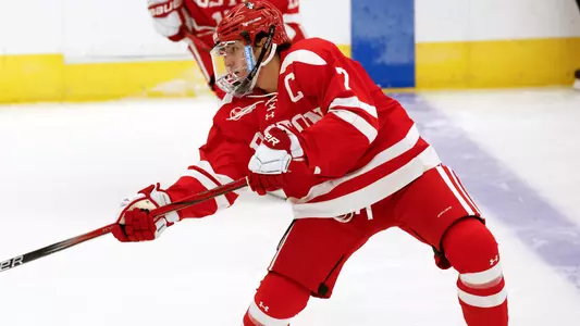 Case McCarthy shooting the puck