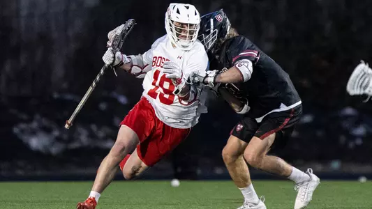 Timmy Ley playing lacrosse against Harvard
