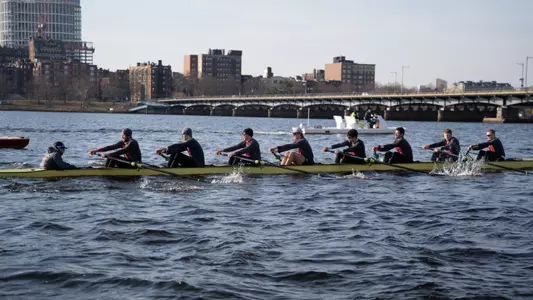 Photo of the Men's Rowing Third Varsity 8 on the Charles River during practice.