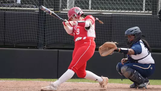 Nicole Amodio makes contact swinging at a pitch at Charlotte.