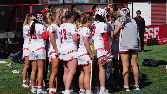 Women's Lacrosse Huddle on the sideline