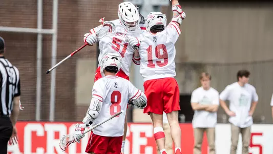 Tommy Bourque and Timmy Ley jump into one another to celebrate a goal