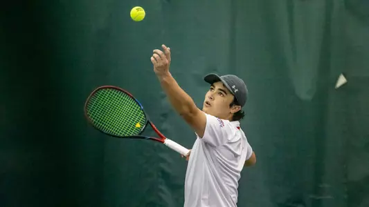 Alejandro Licea tosses the ball up during a serve attempt