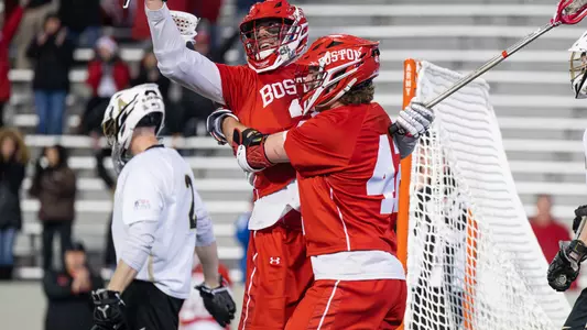 Thomas Niedringhaus and Jake Cates celebrating Niedringhaus' game-winning goal at Army West Point