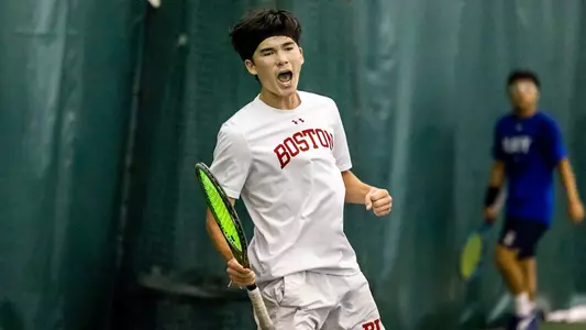Corey Craig gives a fist pump after winning a tennis point in singles action