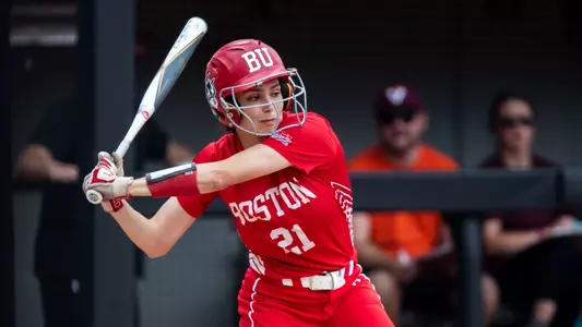 Kayla Roncin is in the middle of her swing at the plate batting right handed against Virginia Tech at 2023 NCAA regionals.