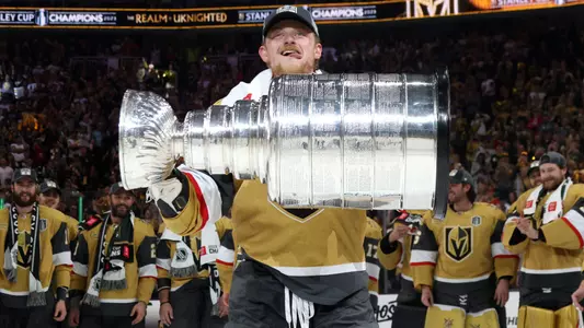 Jack Eichel lifting the Stanley Cup with the Vegas Golden Knights