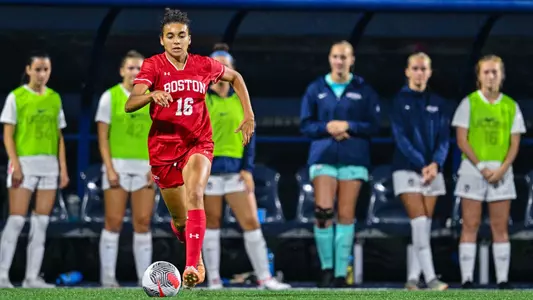 Photo of women's soccer sophomore Shayla Brown dribbling the ball at UConn.
