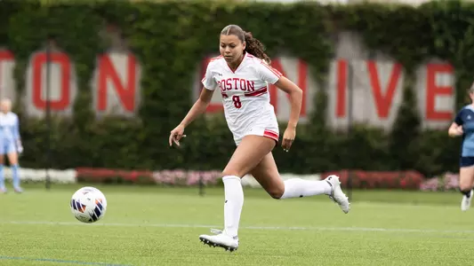 Photo of women's soccer freshman Kaiya Stewart dribbling the ball at Nickerson Field.