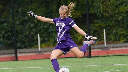 Photo of women's soccer junior Celia Braun kicking a goal kick.