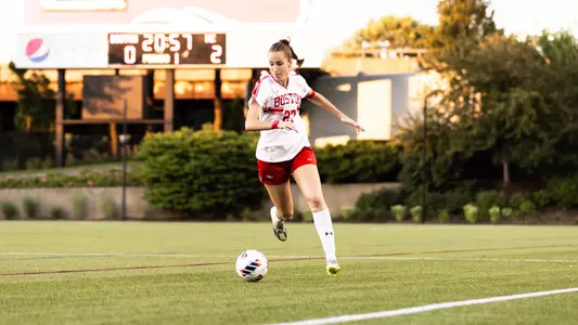 Photo of women's soccer freshman Kat Slott dribbling the ball in a scrimmage.