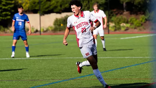 Eitan Rosen celebrates with a fist bump after helping Alex Bonnington score a goal against UMass Lowell.