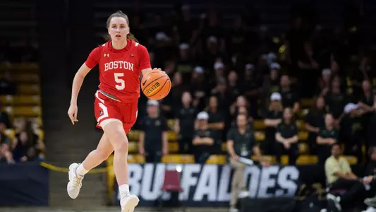 Photo of women's basketball freshman Aoibhe Gormley dribbling at Colorado.
