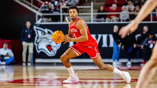 Ethan Okwuosa holds the ball at Davidson looking to dribble or pass.