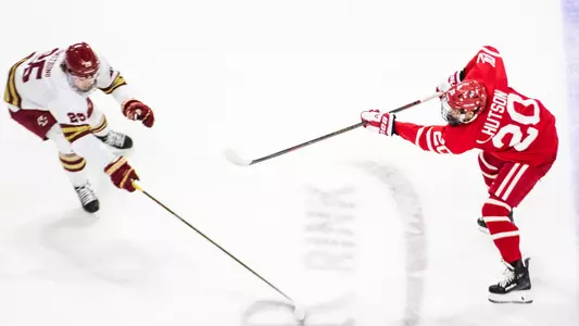 Lane Hutson shooting the puck against BC