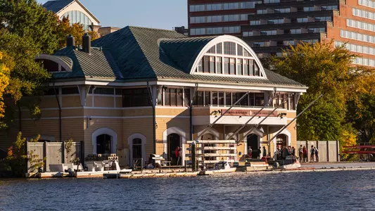 Photo of the DeWolfe Boathouse during a morning rowing practice.
