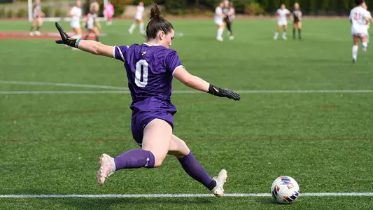 Photo of women's soccer freshman Bridget Carr kicking the ball at Nickerson Field.