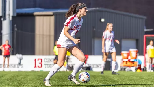 Photo of women's soccer junior Helene Tyburczy dribbling the ball at Nickerson Field.