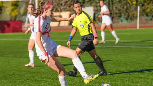 Photo of women's soccer sophomore Kat Slott securing a ball at Nickerson Field.