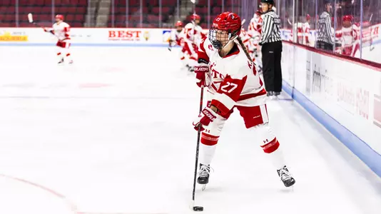 Kiera Healey with the puck in Agganis against Merrimack
