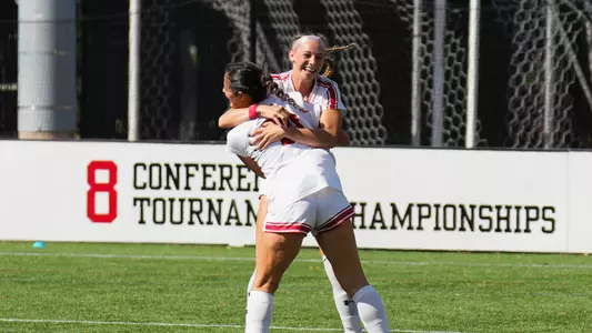 Photo of women's soccer freshmen Jaiden Schultz and Juliana Osterman celebrating a goal against Navy.