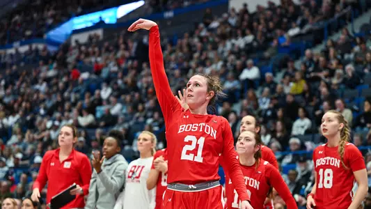 Photo of women's basketball sophomore Audrey Ericksen's follow-through on a three-pointer against UConn.