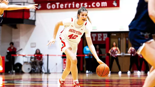 Photo of women's basketball freshman Allison Schwertner dribbling the basketball.