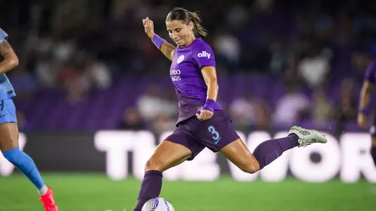 Photo of women's soccer alumna Kylie Strom playing soccer for the Orlando Pride