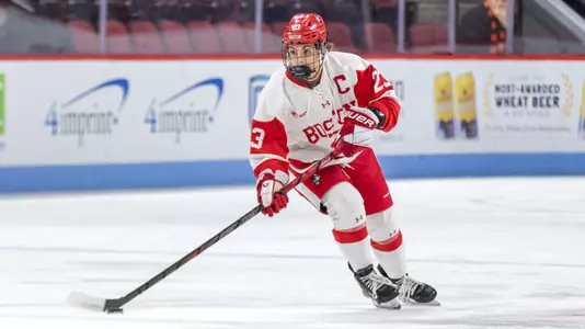 Tamara Giaquinto skating with the puck