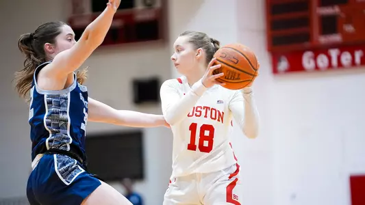 Photo of women's basketball freshman Hildur Gunnsteinsdóttir matching up against a Georgetown defender.