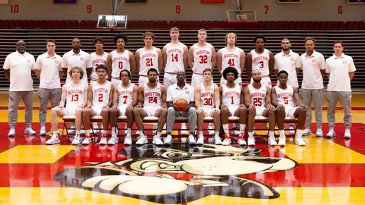2024-25 Boston University men's basketball team photo with 15 players and seven staff members