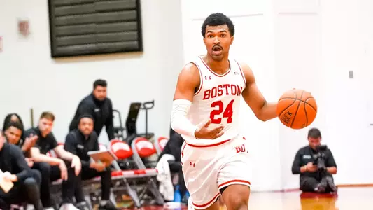 Miles Brewster dribbles the ball up the court against Wagner.