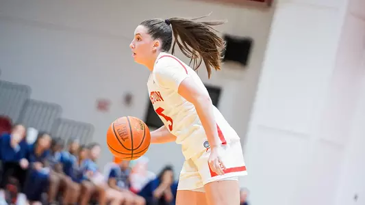 Photo of women's basketball sophomore Aoibhe Gormley dribbling the ball at Case Gym.