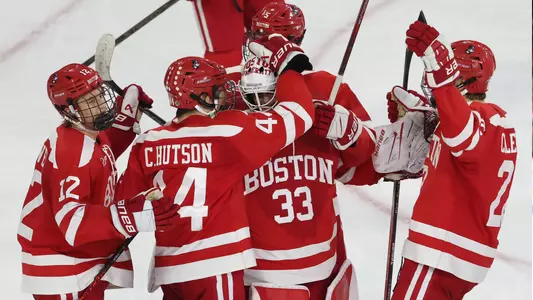 Men's ice hockey players celebrating a win at UMass Lowell