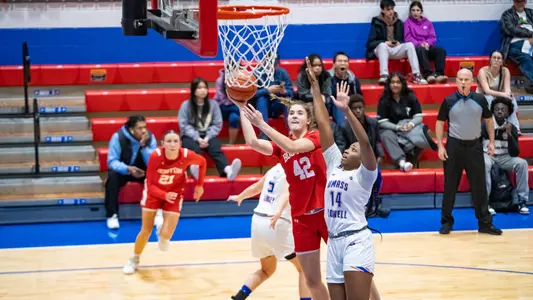 Photo of women's basketball freshman Allison Schwertner shooting a layup at UMass Lowell.
