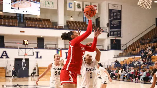 Photo of women's basketball freshman Channing Warren shooting a layup at Yale.